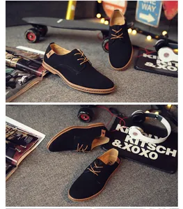 Stylish mens black suede casual shoes displayed with lifestyle props like a skateboard