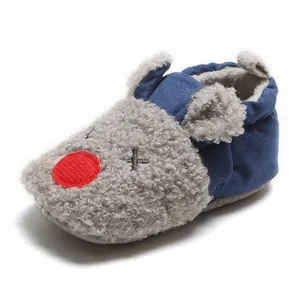 Close-up of navy blue cartoon baby indoor winter shoes with soft soles for infants