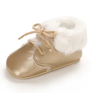 Gold baby fur boots with soft sole and white plush lining detail