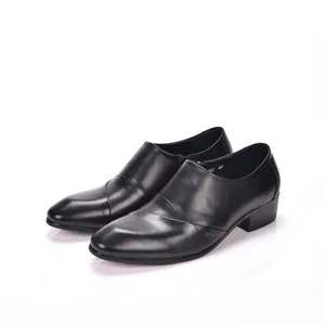 Detailed close-up view of premium black leather pointed-toe dress shoes for men