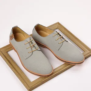 Detailed view of gray frosted leather men's casual dress shoes with wooden frame.