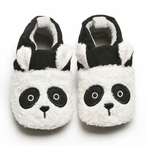 Close-up view of the adorable plush panda design on these warm winter baby indoor slippers