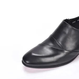 Detailed macro view showing the smooth black top grain cowhide leather material
