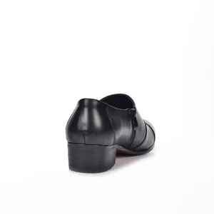 Close-up detail of the back heel and side zipper on these black leather men's dress shoes