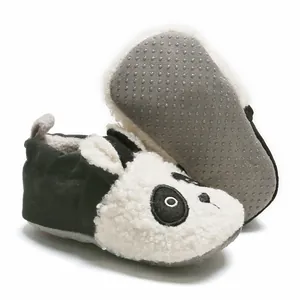 Detailed view of panda baby booties showing the soft fleece texture and anti-slip sole