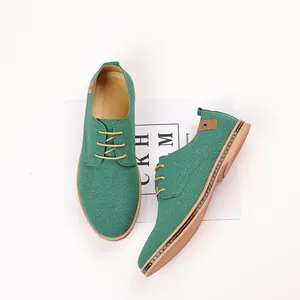 Detailed view of green suede men's casual derby shoes featuring durable gum rubber soles