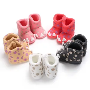Colorful claw-themed baby winter snow boots arranged in a circular professional display