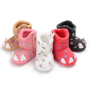 Detail view of colorful soft fleece baby winter boots featuring a cute white claw design