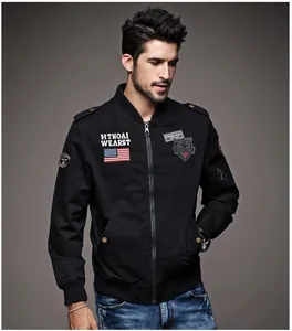 Close-up of men's black cotton bomber jacket with military embroidery patches