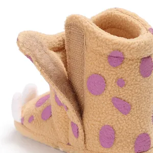 Close-up of baby warm claw boots with soft fleece material and velcro