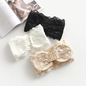 Detailed view of lace bandeau bras with three-row hook closure and floral patterns.