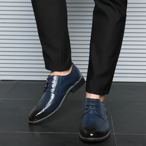 Classic men's navy blue brogue dress shoes with lace-up design and gradient black toe detail