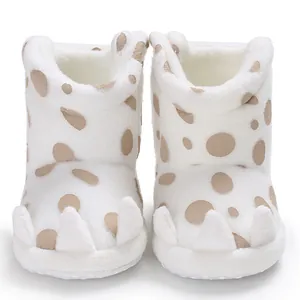 Soft white plush baby snow boots featuring brown polka dots and cute claw design
