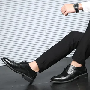 Elegant black leather Brogue dress shoes for men featuring a classic lace-up design