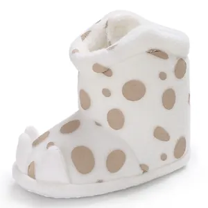 Close-up detail showing the plush texture and cute claw design on baby winter boots.