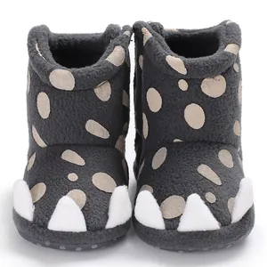 Front view of grey baby winter boots with white decorative claw details and dots