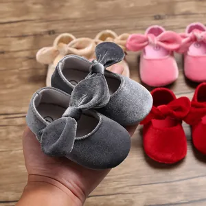Soft velvet baby princess walker shoes featuring elegant bows in various vibrant colors