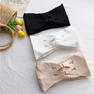Detailed view of seamless ice silk strapless bandeau bras in black, white, and beige