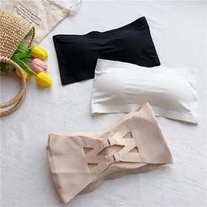 Detailed view of seamless strapless bandeau bras in black, white, and beige colors