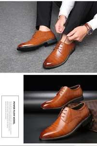 Dettaglio di scarpe stringate da uomo in pelle marrone stile brogue.