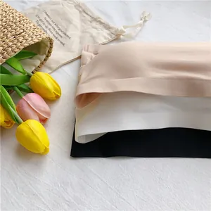 Close-up detail of ice silk seamless tube tops in nude, white, and black colors.