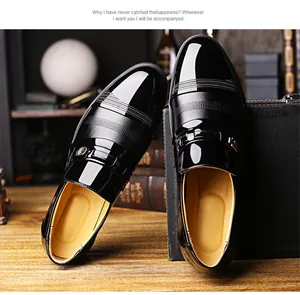 Detailed view of glossy black men's leather dress shoes with textured stripe patterns