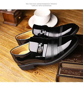 Close-up view of glossy black men's patent leather dress shoes for formal business attire
