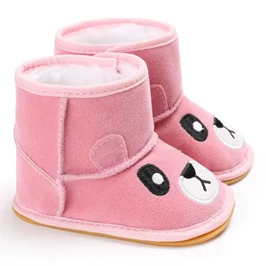 Detail of pink cartoon baby winter boots featuring soft plush lining and non-slip sole