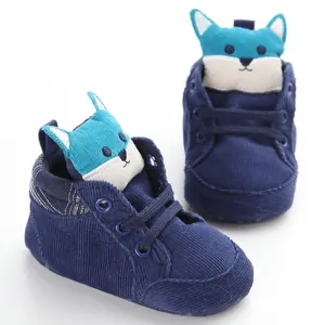 Detail view of navy corduroy baby walking shoes with a cute blue fox design.