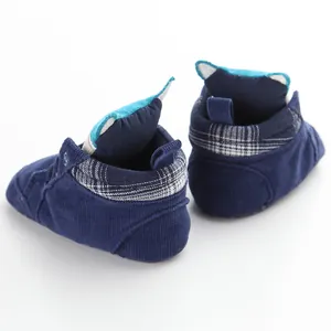 Detailed back view of navy blue corduroy baby walking shoes with fox ear design.