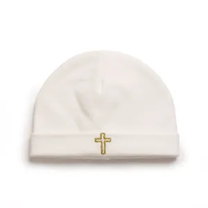 Soft white knitted baby beanie hat with an elegant gold embroidered cross detail
