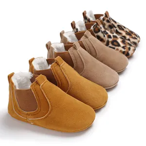 Close-up of soft fleece-lined baby walking boots in various colors and leopard print