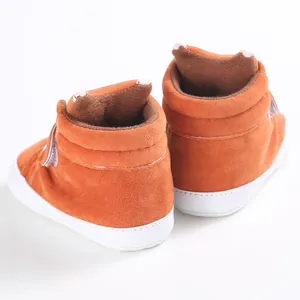 Detailed rear view of orange soft-sole baby walker shoes for infants aged 0 to 1 year