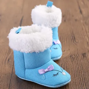 Soft warm light blue baby winter boots with white faux fur lining and cute purple bow