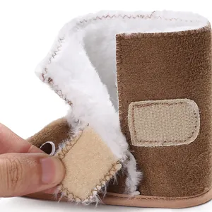Close-up detail of soft baby winter boot with fluffy lining and hook-and-loop closure
