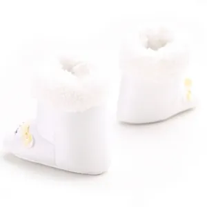 Rear view of soft white baby snow boots with fluffy fur trim and yellow bow detail