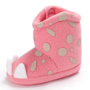 Detailed side profile of soft-soled pink plush baby winter boots with monster claw design