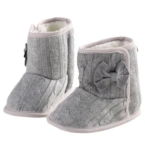 Cozy grey infant winter boots with soft soles and decorative bow design for baby