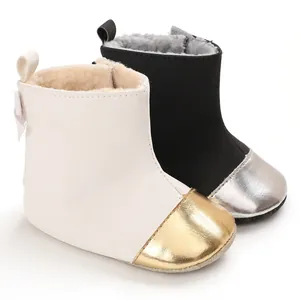 Close-up view of warm winter baby walking boots with soft soles and plush lining.