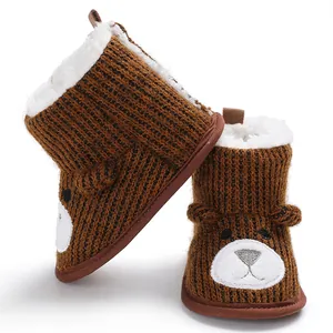 Cozy brown knitted baby bear boots with soft white fleece lining for winter