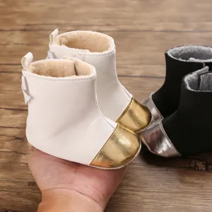 Cozy winter baby boots with thick faux fur lining and stylish metallic gold toe detail