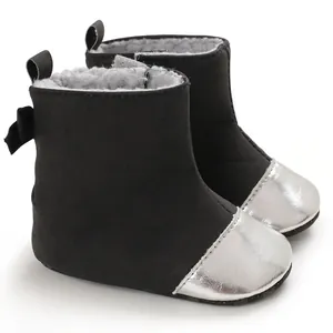 Warm black baby boots with silver toe cap and soft faux fur lining for infants