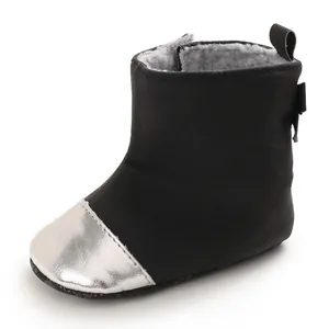 Side view of black baby winter boots with silver metallic toe cap and fleece lining