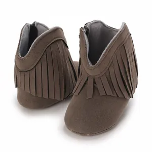 Close-up of brown fringe baby snow boots with soft soles for walking infants and toddlers