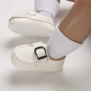 Detailed view of white soft-soled baby walking shoes with buckle strap