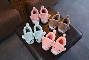 Four pairs of cute cartoon shark plush slippers for kids in various soft pastel colors.