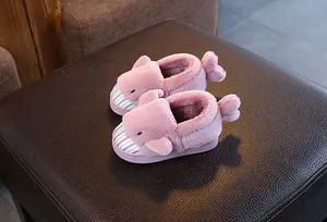 Detailed view of pink cartoon shark plush slippers for kids with soft material