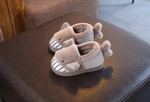 Detailed view of cute grey shark plush slippers for kids with a soft striped toe cap