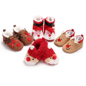Detailed macro view of multiple Christmas baby walker shoes with festive characters.