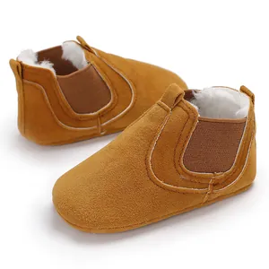 Cozy camel suede baby winter shoes with thick white fleece lining for toddlers.